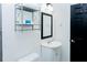 Bright bathroom with a white vanity and a dark framed mirror at 240 W Lake Nw Dr, Atlanta, GA 30314
