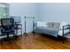 Cozy bedroom with a desk, hardwood floors, and a twin bed at 240 W Lake Nw Dr, Atlanta, GA 30314
