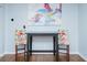Small dining area features hardwood floors and a colorful art piece at 240 W Lake Nw Dr, Atlanta, GA 30314
