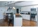 Updated kitchen with stainless steel appliances, granite countertops, and a breakfast bar at 240 W Lake Nw Dr, Atlanta, GA 30314