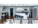 Open-concept living room featuring a kitchen, black door, and living room set at 240 W Lake Nw Dr, Atlanta, GA 30314