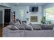 Bright and airy living room with fireplace, a large comfortable couch, and hardwood floors at 240 W Lake Nw Dr, Atlanta, GA 30314