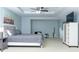 Spacious main bedroom with a tray ceiling and contemporary furnishings at 240 W Lake Nw Dr, Atlanta, GA 30314