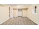 Open basement space with neutral carpeting, a closet, and a window for natural light at 3656 Tulip Dr, Decatur, GA 30032