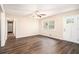 Bright living room with wood-look floors, neutral walls, and a front door with glass panes at 3656 Tulip Dr, Decatur, GA 30032