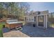 Backyard featuring a spa, a shed, and a patio made of pavers at 3740 Williams Point Dr, Cumming, GA 30028