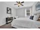 Comfortable bedroom with carpet, end tables, and lots of natural light at 3740 Williams Point Dr, Cumming, GA 30028