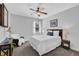Cozy bedroom features plush carpet, ceiling fan, and large windows at 3740 Williams Point Dr, Cumming, GA 30028