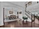 Dining room with hardwood floors, natural light, and adjacent stairs at 3740 Williams Point Dr, Cumming, GA 30028