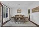 Dining room with a neutral color palette, chandelier and hardwood floors at 3740 Williams Point Dr, Cumming, GA 30028