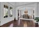 Elegant dining room with a chandelier, hardwood floors, and white molding at 3740 Williams Point Dr, Cumming, GA 30028