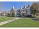 Lovely home with a well-kept lawn and inviting walkway leading to the entrance at 3740 Williams Point Dr, Cumming, GA 30028