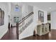 Grand foyer with high ceilings, hardwood floors, a staircase, and decorative accents at 3740 Williams Point Dr, Cumming, GA 30028