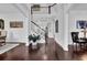 Bright foyer with hardwood floors, elegant staircase, and inviting decor at 3740 Williams Point Dr, Cumming, GA 30028