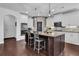 Kitchen featuring an island, stainless steel appliances and a black accent door at 3740 Williams Point Dr, Cumming, GA 30028