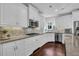 Bright kitchen with white cabinetry, stainless steel appliances, and granite countertops at 3740 Williams Point Dr, Cumming, GA 30028
