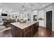 Open kitchen design with a large center island and barstool seating at 3740 Williams Point Dr, Cumming, GA 30028
