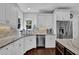 Kitchen with stainless steel appliances, white cabinetry, and granite countertops at 3740 Williams Point Dr, Cumming, GA 30028