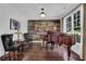 Stylish living room featuring a grand piano, hardwood floors, and elegant furnishings at 3740 Williams Point Dr, Cumming, GA 30028