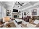 Spacious living room with beamed ceilings, stone fireplace, and hardwood flooring at 3740 Williams Point Dr, Cumming, GA 30028