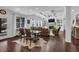 Spacious living room area featuring a fireplace, coffered ceiling, and hardwood floors at 3740 Williams Point Dr, Cumming, GA 30028