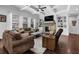 Cozy living room with fireplace, TV, and comfortable seating at 3740 Williams Point Dr, Cumming, GA 30028