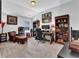 Comfortable office with bookshelves, desk, chair, providing an ideal workspace at 3740 Williams Point Dr, Cumming, GA 30028
