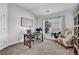 Bright office space with natural light, a writing desk, and a cozy chair, perfect for productivity at 3740 Williams Point Dr, Cumming, GA 30028