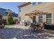 Backyard features an outdoor dining set, barbecue grill, and a paver patio at 3740 Williams Point Dr, Cumming, GA 30028