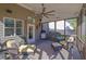 Relaxing screened-in porch featuring comfortable seating, ceiling fan, and outdoor views at 3740 Williams Point Dr, Cumming, GA 30028