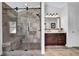 Luxurious marble shower featuring a built-in bench and sleek glass enclosure in bathroom at 3740 Williams Point Dr, Cumming, GA 30028