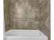 Close up of the shower and tub with tiled walls in the bathroom at 3740 Williams Point Dr, Cumming, GA 30028