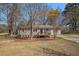 Charming single-story home featuring a well-maintained lawn and a quaint front porch at 10164 Sunny Sw Dr, Covington, GA 30014