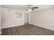 Spacious living room with hardwood floors, neutral paint, and a view into adjacent rooms at 10164 Sunny Sw Dr, Covington, GA 30014