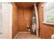 A utility room with water heater and visible wood framing at 10164 Sunny Sw Dr, Covington, GA 30014