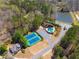 Aerial view of neighborhood amenities including tennis courts, pool and parking at 2025 Fairway Crossing Dr, Woodstock, GA 30188