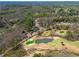 Scenic aerial view of a golf course and community with mature trees and inviting streetscapes at 2025 Fairway Crossing Dr, Woodstock, GA 30188
