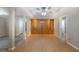 Open basement area with wood paneling, hardwood flooring, and recessed lighting for flexible use at 2025 Fairway Crossing Dr, Woodstock, GA 30188