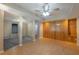 Finished basement with wood paneling, ceiling fan, and doorways to other rooms at 2025 Fairway Crossing Dr, Woodstock, GA 30188