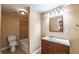 Cozy bathroom features a vanity with wood cabinets, a tiled shower-tub combination, and a neutral color palette at 2025 Fairway Crossing Dr, Woodstock, GA 30188