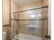 Tiled tub and shower combination featuring glass doors at 2025 Fairway Crossing Dr, Woodstock, GA 30188