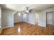 Upstairs bedroom with hardwood floors, ceiling fan, neutral paint and natural light at 2025 Fairway Crossing Dr, Woodstock, GA 30188