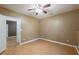 Bedroom featuring hardwood floors, neutral paint, and a ceiling fan for comfort at 2025 Fairway Crossing Dr, Woodstock, GA 30188