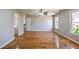 Bright bedroom boasts hardwood floors, natural light, and neutral paint, creating a serene and inviting atmosphere at 2025 Fairway Crossing Dr, Woodstock, GA 30188