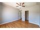 Spacious bedroom featuring a ceiling fan, hardwood floors and neutral paint at 2025 Fairway Crossing Dr, Woodstock, GA 30188