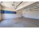 Spacious garage with epoxy flooring, overhead storage and interior access door at 2025 Fairway Crossing Dr, Woodstock, GA 30188