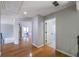 Upstairs hallway with hardwood floors leads to bedrooms and bathroom at 2025 Fairway Crossing Dr, Woodstock, GA 30188