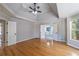 Spacious main bedroom featuring hardwood floors and entry into the ensuite bathroom at 2025 Fairway Crossing Dr, Woodstock, GA 30188