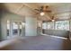 Spacious screened porch featuring wood ceiling, ceiling fans, and access to the backyard at 2025 Fairway Crossing Dr, Woodstock, GA 30188