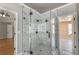 Modern bathroom featuring large glass shower with multiple shower heads at 2025 Fairway Crossing Dr, Woodstock, GA 30188